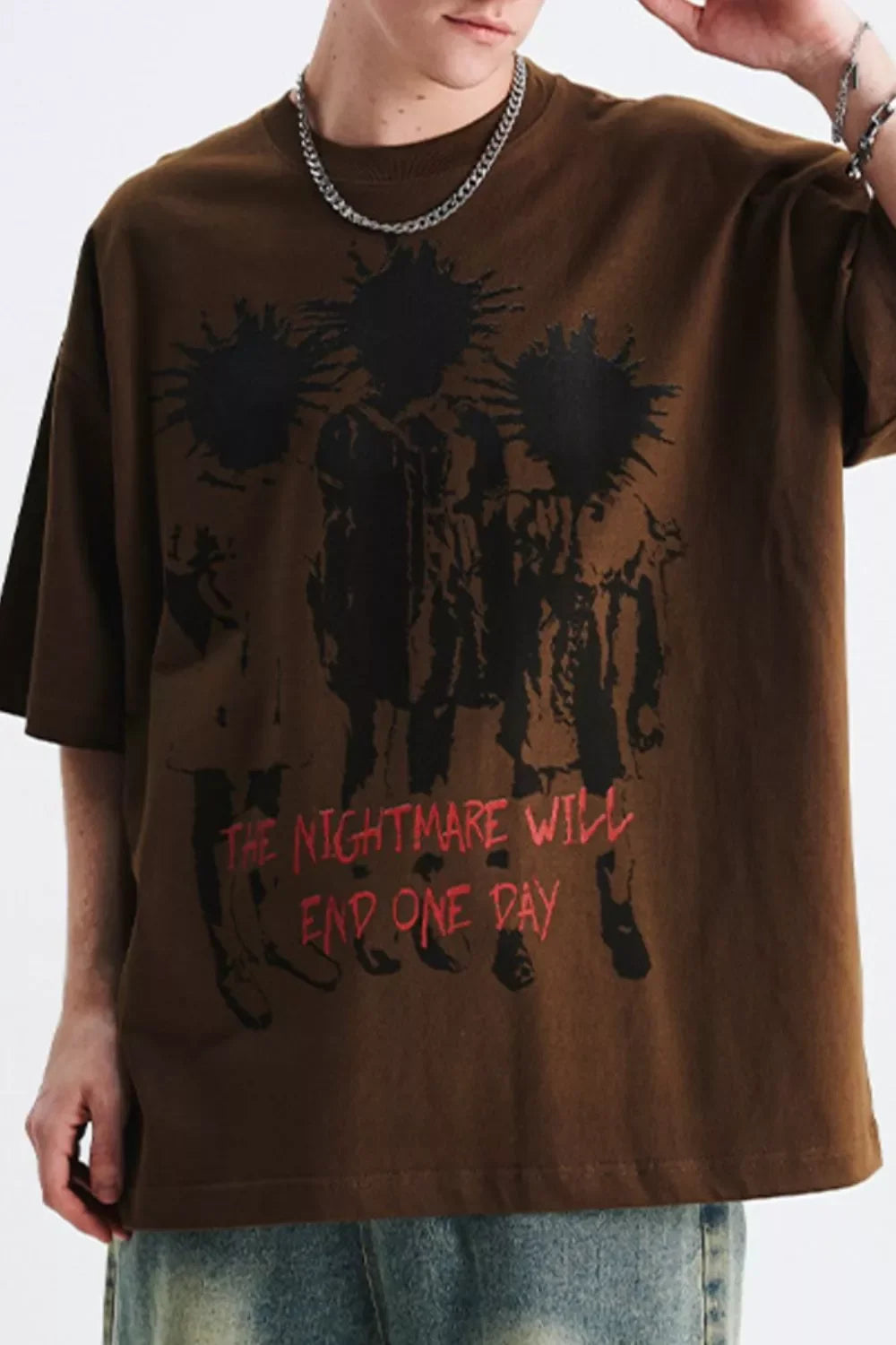 Oversized brown streetwear t-shirt with bold black graphic and red text, men's urban fashion