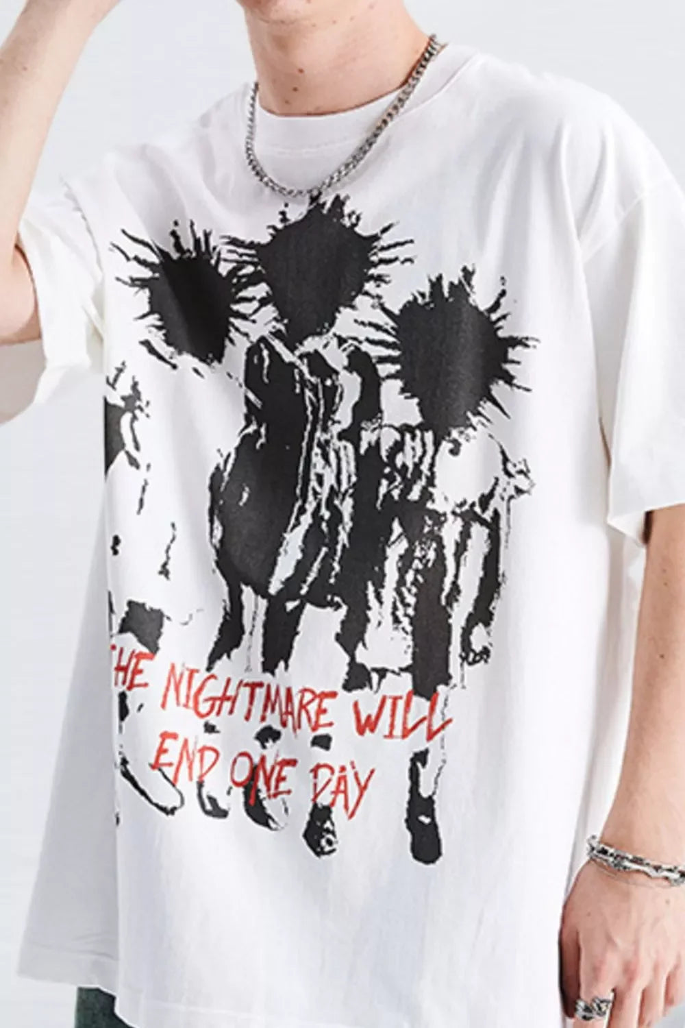 Oversized white streetwear t-shirt with bold black graphic and red text, men's urban fashion