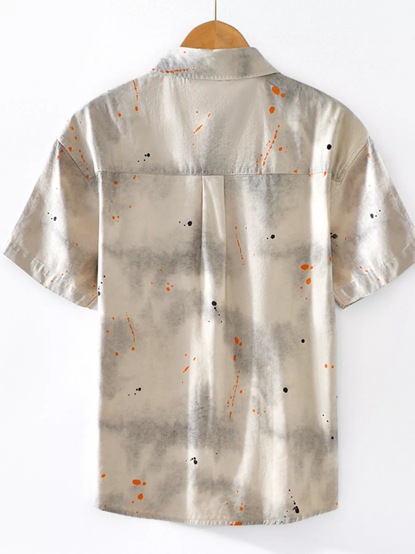 Men's short sleeve streetwear shirt with beige tie-dye and orange paint splatter design