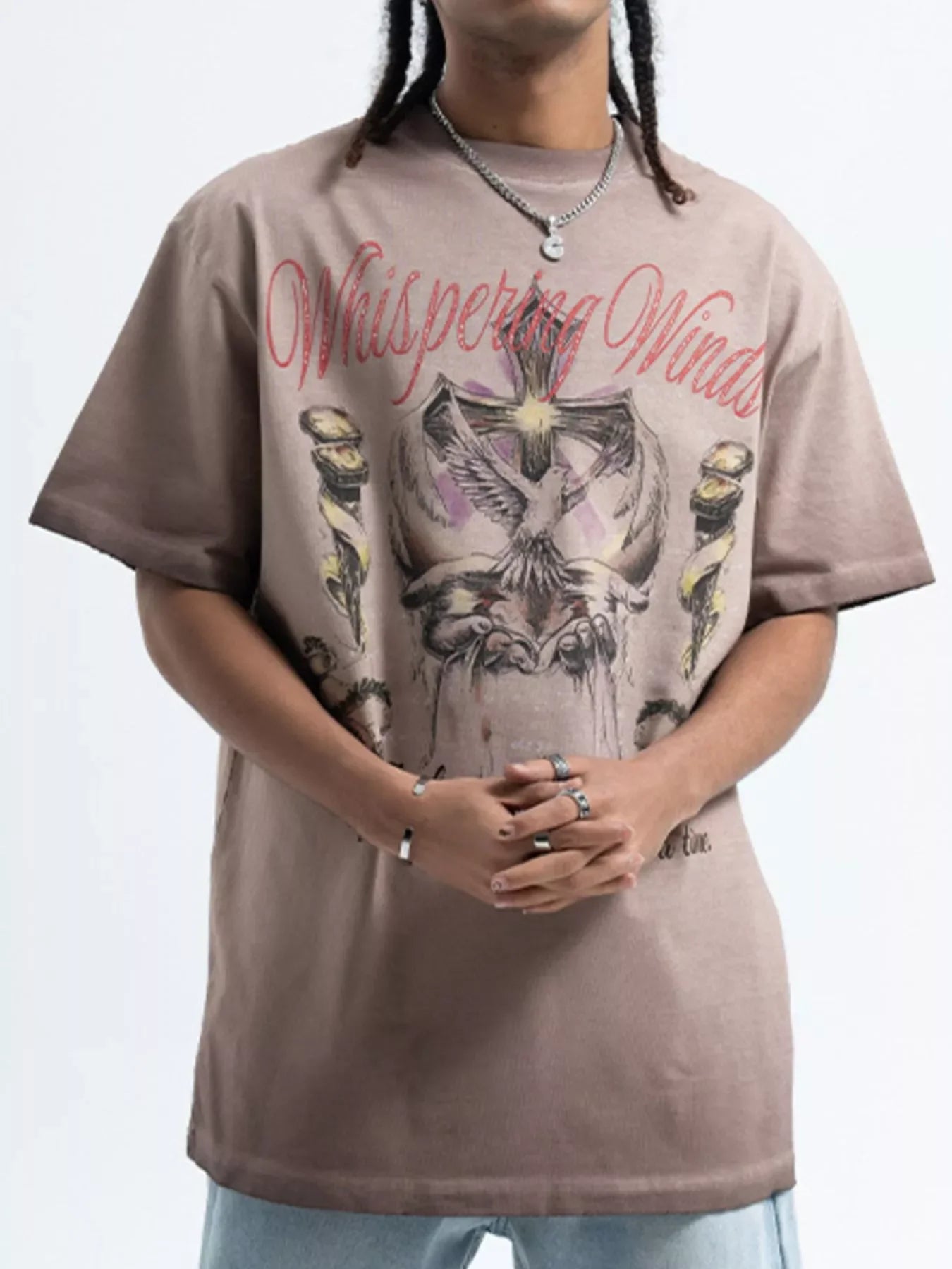 Oversized streetwear graphic t-shirt for men with 'Whispering Winds' text and illustrated design.