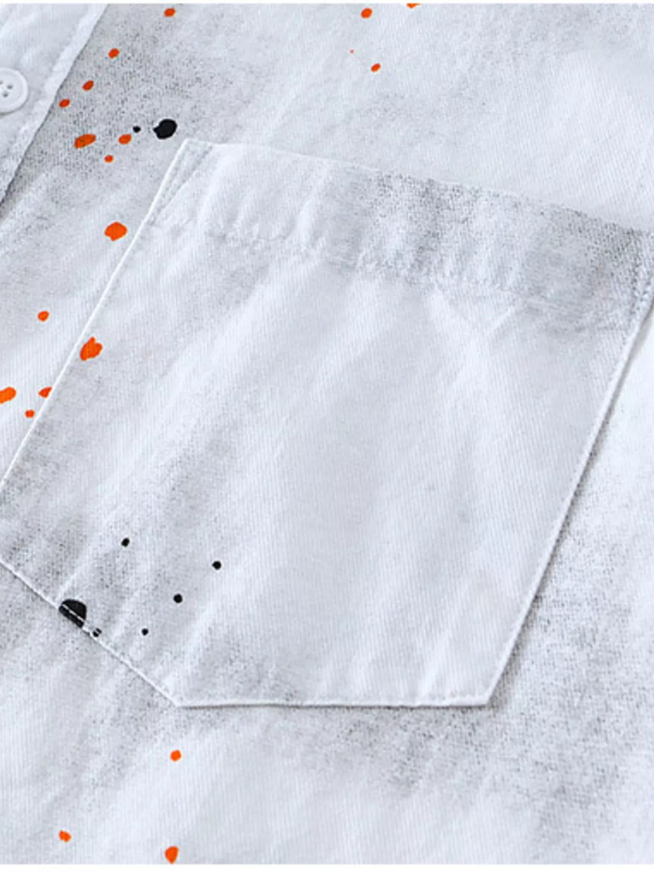 White streetwear shirt with front pocket and orange black paint splatter design