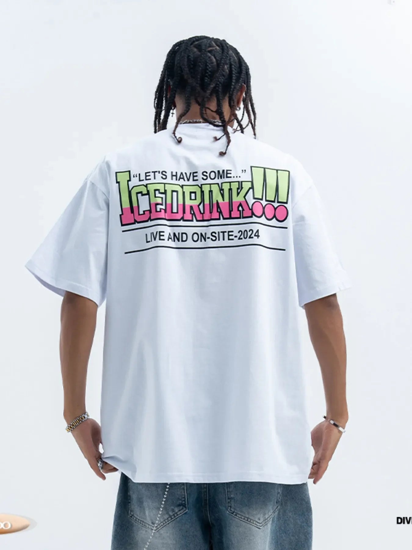 Man wearing oversized graphic streetwear t-shirt with colorful print and loose jeans