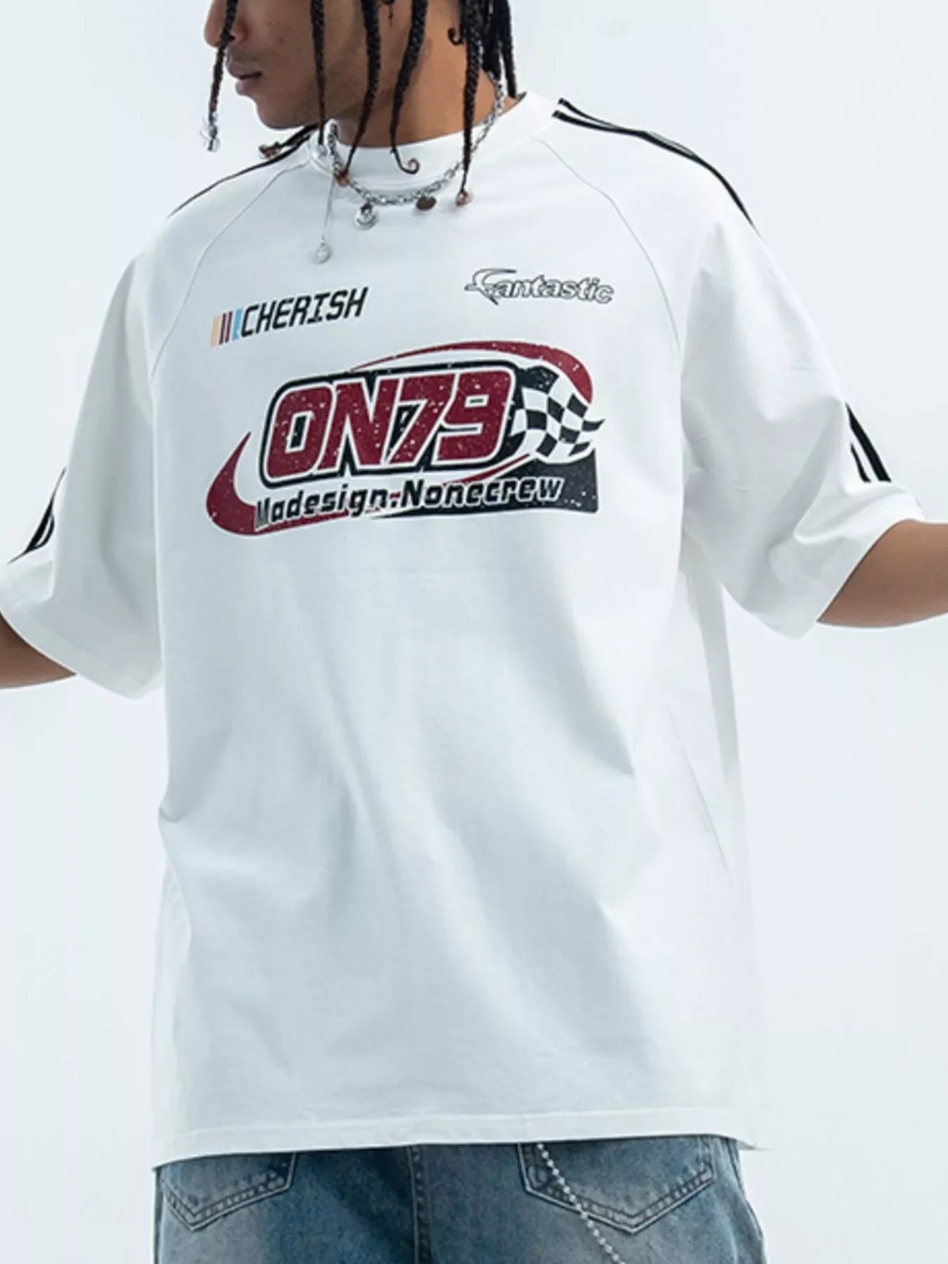 Man wearing oversized streetwear graphic t-shirt with ON79 logo and relaxed jeans